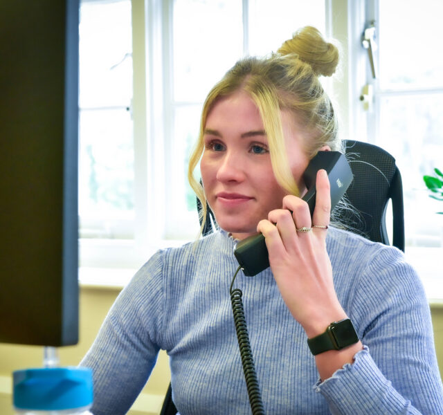 One of our accountants, Amy O'Keeffe, working at her office desk